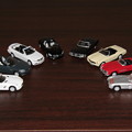 写真: ジョージアのメルセデス・ベンツ ダイキャストオープンカー。左から時計回りでSLS、SLK、E、SL、350SL、230SL、300SL、300SLR。