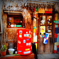 写真: 真っ赤なドラム缶のある店
