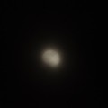 写真: 霞む月